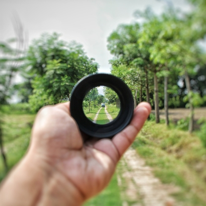 focus on distance in a farmer's field looking through a lens investment insights