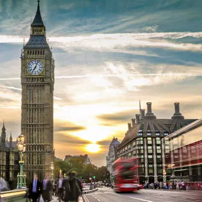 city of London facing Big Ben with an onrushing London red bus